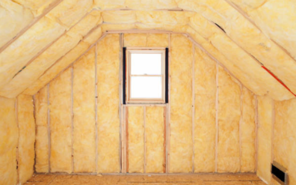 Glass wool insulation material being handled